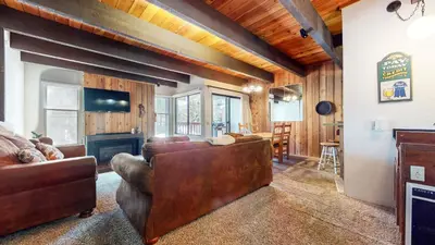 a living room with a couch and a fireplace at Val D'Isere #6 Condo in Mammoth Lakes