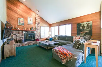 a living room with a couch and a fireplace at Sierra Megeve #8 Condo in Mammoth Lakes