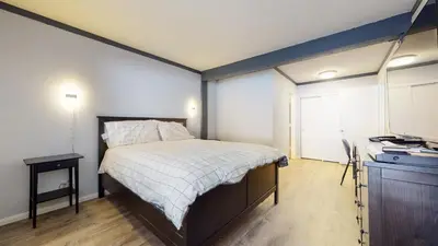 a bedroom with a bed and a television in it at Mammoth Ski & Racquet Club #4 Condo in Mammoth Lakes