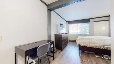 a bedroom with a desk and a bed at Mammoth Ski & Racquet Club #4 Condo in Mammoth Lakes