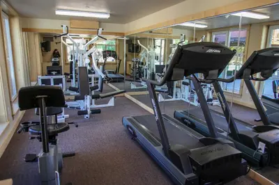 a gym with treadmills and elliptical machines at Sunstone #127 Condo in Mammoth Lakes