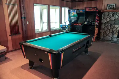 a pool table in a room with a game at Horizons 4 #150 Condo in Mammoth Lakes