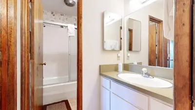 a bathroom with a sink and a toilet and a shower at Chateau Blanc #25 Condo in Mammoth Lakes