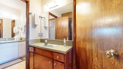 a bathroom with a sink and a mirror at Chateau Blanc #25 Condo in Mammoth Lakes