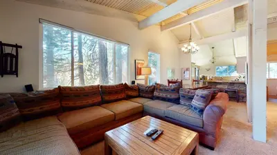 a living room with couches and a coffee table at Mammoth West #115 Condo in Mammoth Lakes
