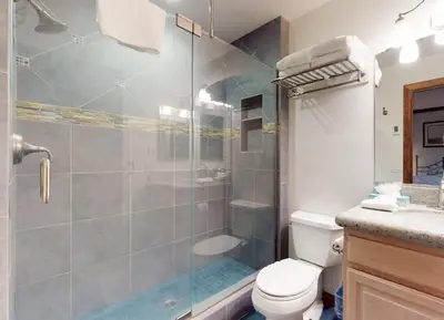 a bathroom with a shower and a toilet at Mammoth West #101 Condo in Mammoth Lakes