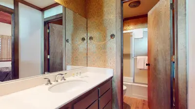 a bathroom with a sink and a mirror at Mammoth West #124 Condo in Mammoth Lakes
