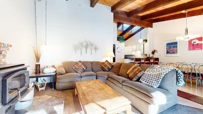 a living room with a couch and a table at Chateau De Montagne #3 Condo in Mammoth Lakes