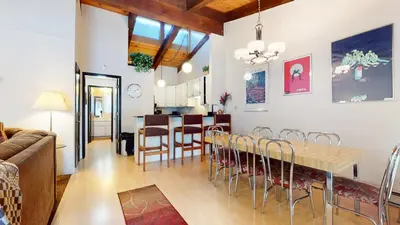 a dining room and living room with a table and chairs at Chateau De Montagne #3 Condo in Mammoth Lakes
