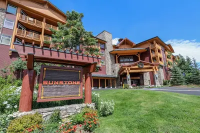 a large building with a sign in front of it at Sunstone #208 Condo in Mammoth Lakes