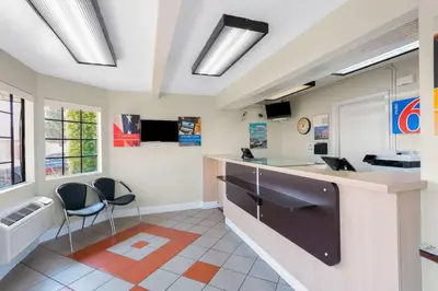 a kitchen with two chairs and a counter in a room at Motel 6-Merced, CA - North in Merced