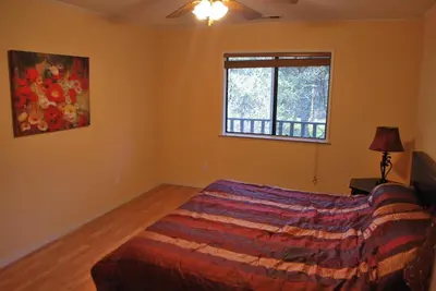 a bedroom with a bed and a window at Yosemite is Calling in Groveland