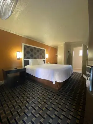 a hotel room with a large bed in a room at Budget INN At The Heavenly Gondola in South Lake Tahoe