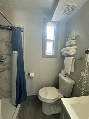 a bathroom with a toilet and a shower at Budget INN At The Heavenly Gondola in South Lake Tahoe