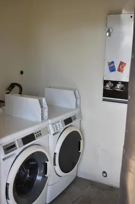 a washer and dryer in a small room at Apex Inn in Modesto