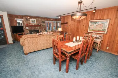 a living room with a table and a couch at Mountainback 45 Den in Mammoth Lakes