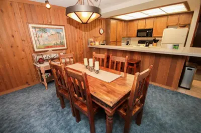 a dining room with a wooden table and chairs at Mountainback 45 Den in Mammoth Lakes