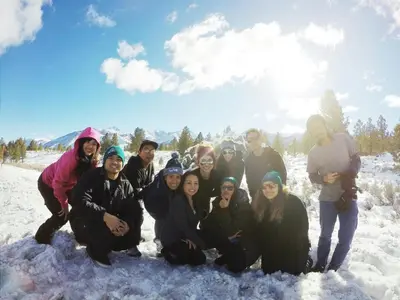 a group of people posing for a picture in the snow at Mountainback 41 Loft in Mammoth Lakes