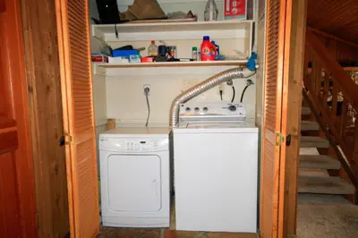 a kitchen with a sink and a washing machine at Mountainback 40 Loft Corner in Mammoth Lakes