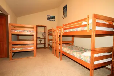 a room with four bunk beds in a room at Mountainback 40 Loft Corner in Mammoth Lakes