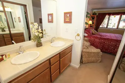 a bathroom with two sinks and a large mirror at Mountainback 38 pet unit in Mammoth Lakes