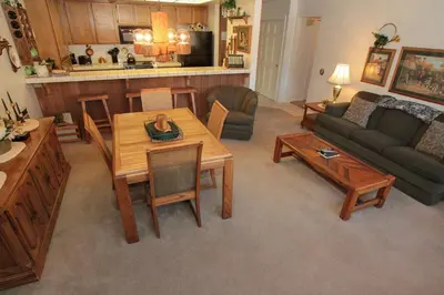 a living room with a table and a couch at Mountainback 38 pet unit in Mammoth Lakes