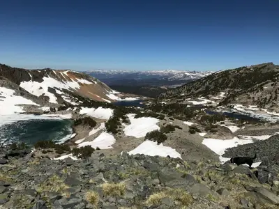 a view from the top of a mountain with snow at Mountainback 37 Den in Mammoth Lakes