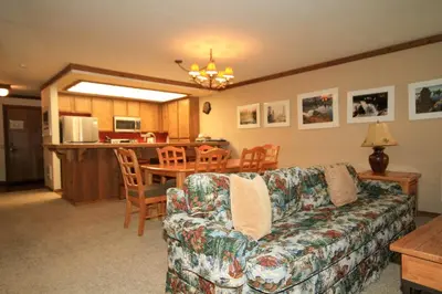 a living room with a couch and a table at Mountainback 37 Den in Mammoth Lakes