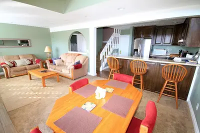 a kitchen and living room with a table and chairs at Mammoth Ski Racquet Club 66 in Mammoth Lakes