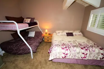 a bedroom with two bunk beds and a window at Mammoth Ski Racquet Club 66 in Mammoth Lakes