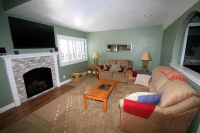 a living room with a couch and a fireplace at Mammoth Ski Racquet Club 66 in Mammoth Lakes