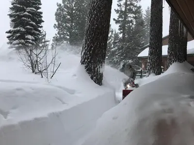 a pile of snow in front of a house at Mountainback 63 Loft Den in Mammoth Lakes