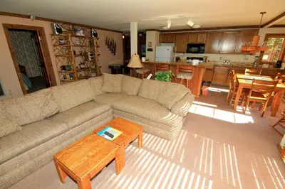 a living room with a couch and a table at Mountainback 60 Corner Unit in Mammoth Lakes