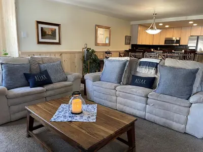 a living room with couches and a table with a candle at Mountainback 57 Den in Mammoth Lakes
