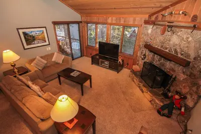 a living room with a couch and a fireplace at Mountainback 53 Loft in Mammoth Lakes