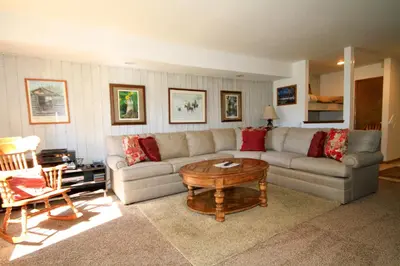 a living room with a couch and a table at Discovery 4 113 in Mammoth Lakes