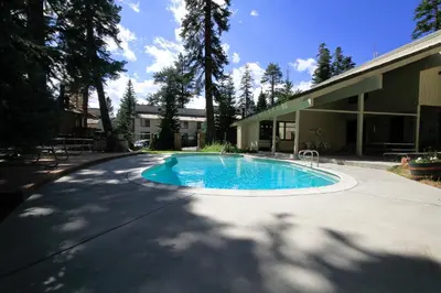 a swimming pool in a driveway next to a building at Discovery 4 113 in Mammoth Lakes