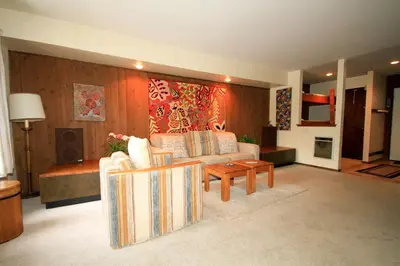 a living room with a couch and a table at Discovery 4 133 in Mammoth Lakes