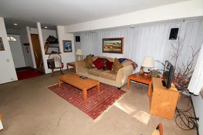 a living room with a couch and a table at Discovery 4 #135 in Mammoth Lakes