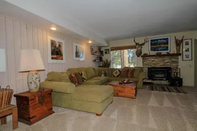 a living room with a couch and a fireplace at Discovery 4 137 in Mammoth Lakes