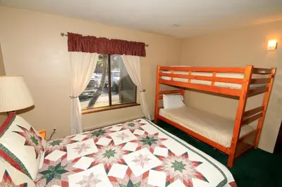 a small bedroom with a bunk bed and a window at Forest Creek 3 Pet accepted in Mammoth Lakes