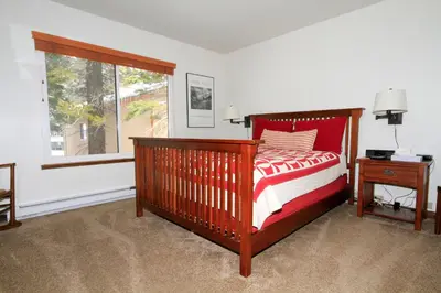 a bedroom with a bed and a window at Discovery 4 152 Loft Pet Ok in Mammoth Lakes
