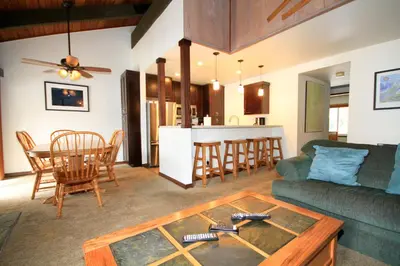 a living room with a couch and a table at Discovery 4 152 Loft Pet Ok in Mammoth Lakes