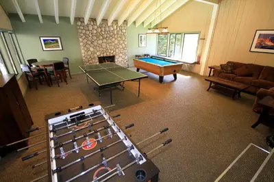 a living room with a ping pong table and a table tennis at Discovery 4 152 Loft Pet Ok in Mammoth Lakes
