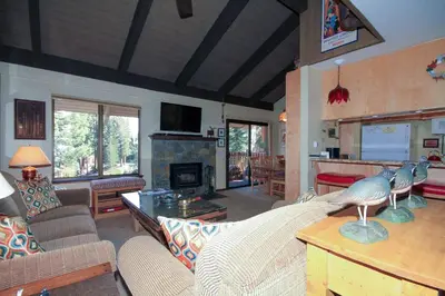a living room with a couch and a fireplace at Discovery 4 142 Loft in Mammoth Lakes