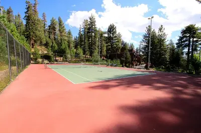 a tennis court with a tennis racket on it at Mammoth Ski & Racquet Club #84 in Mammoth Lakes