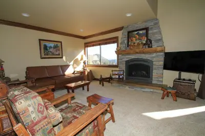 a living room with a couch and a fireplace at Mammoth Ski Racquet Club 67 in Mammoth Lakes