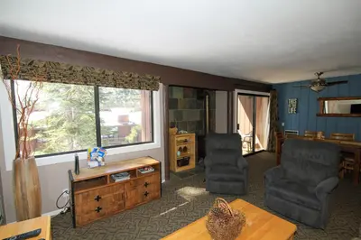 a living room with two chairs and a table at Mammoth Ski Racquet Club 94 2 bedroom Dog Friendly in Mammoth Lakes