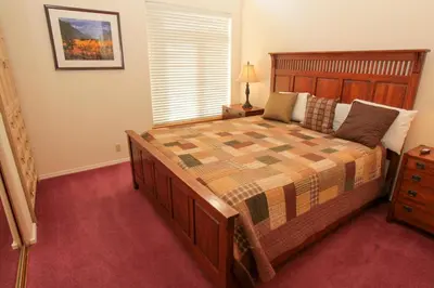 a bedroom with a large bed and a window at Silver Bear #40 in Mammoth Lakes