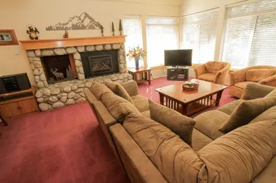 a living room with a couch and a fireplace at Silver Bear #40 in Mammoth Lakes